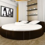Round bed styling with elegant fitted sheets in a minimalist bedroom