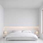 Luxury bed with fresh white cotton sheets and natural light, symbolizing clean and elegant bedding