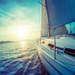 Luxury yacht cruising at sea under clear skies, representing comfort and elegance